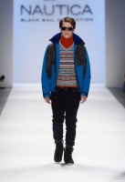 A model walks the runway at the Nautica Men's Fall 2013 fashion show during Mercedes-Benz Fashion Week at The Stage at Lincoln Center on February 8, 2013 in New York City.