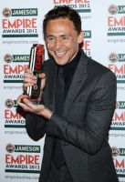 Best Male Newcomer Tom Hiddleston poses in the press room during the 2012 Jameson Empire Awards