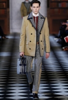 A model walks the runway at Tommy Hilfiger Men's Fall 2013 fashion show during Mercedes-Benz Fashion Week at Park Avenue Armory on February 8, 2013 in New York City.
